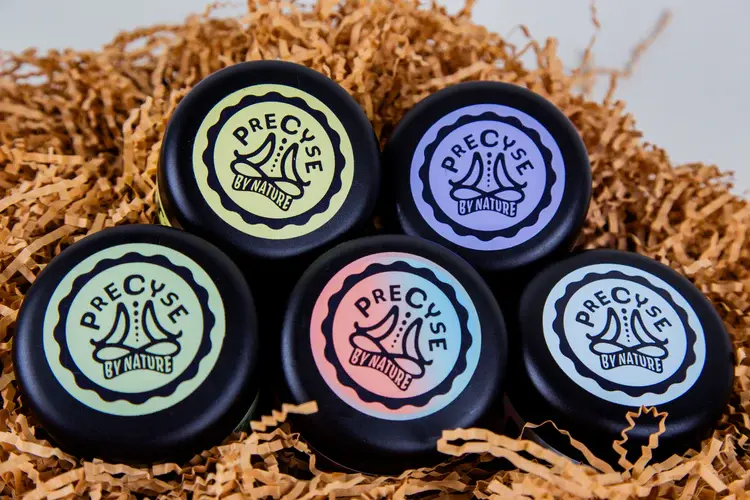 Precyse By Nature plant-whipped body butter jars on linen